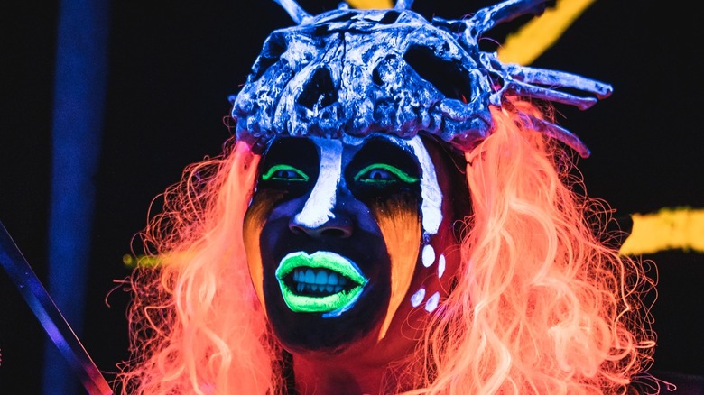 Person with neon-painted face