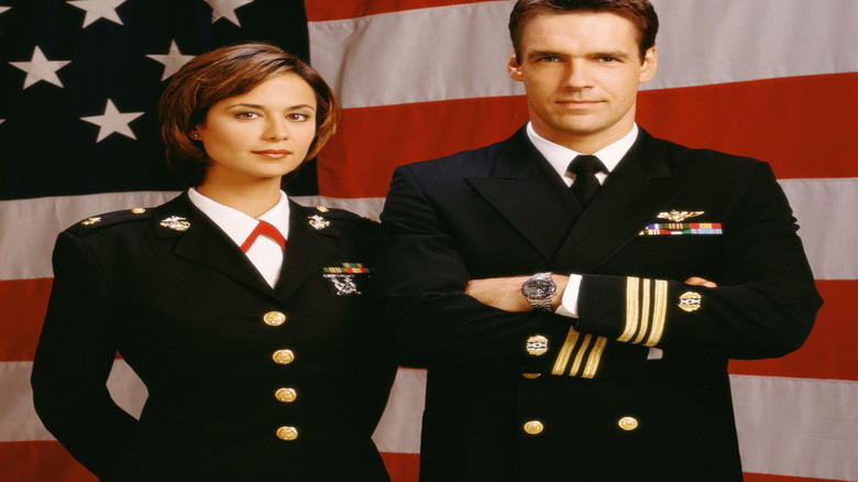 Austen and Rabb in front of flag