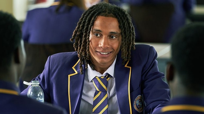 Toby grinning across the table