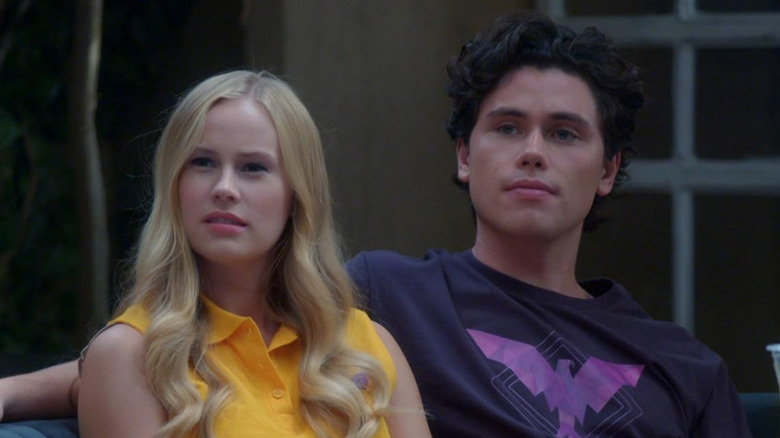 Brooke and Alex talking on the sofa