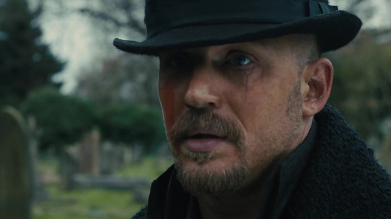 Tom Hardy looks left