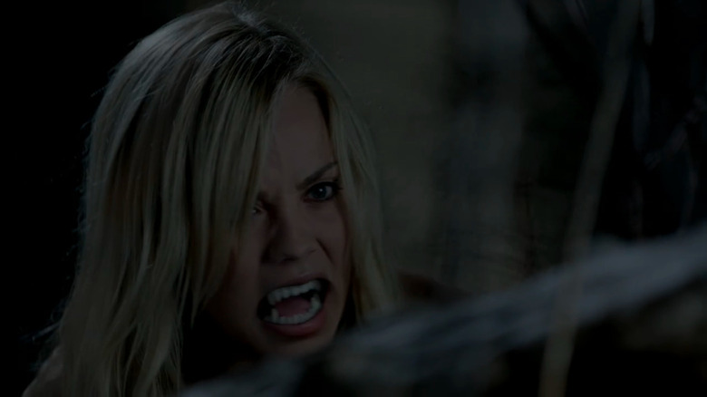 Laura Vandervoort as Elena Michaels turns into a werewolf