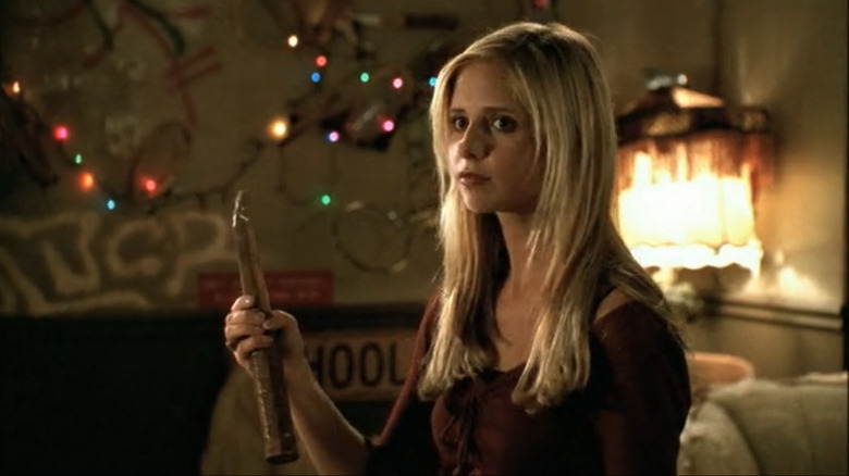 Sarah Michelle Gellar as Buffy holding a stake in Buffy the Vampire Slayer