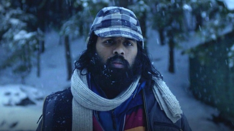 Jeevan standing in the snow in Station Eleven