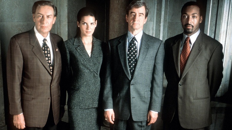 Briscoe, Carmichael, McCoy, and Green in suits