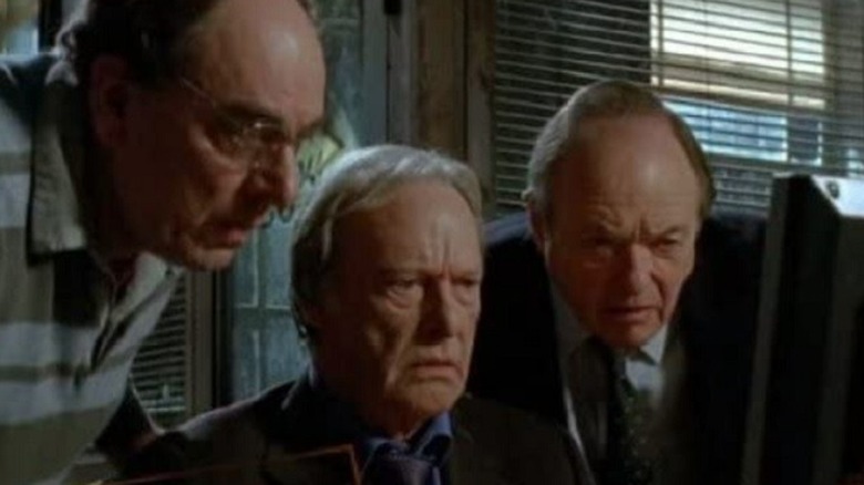 Brian, Jack, and Gerry looking at computer