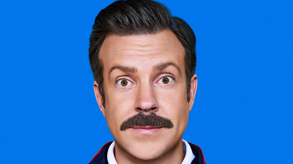 Ted Lasso smiling wide-eyed