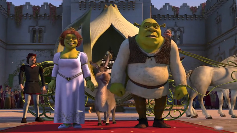 Shrek, Fiona, and Donkey walking red carpet