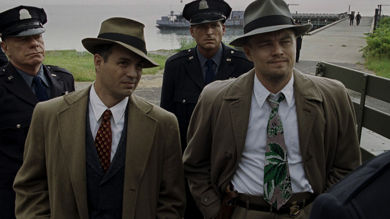 Chuck and Teddy standing with the police