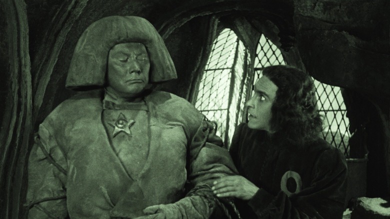 The Golem awakening in front of the Rabbi