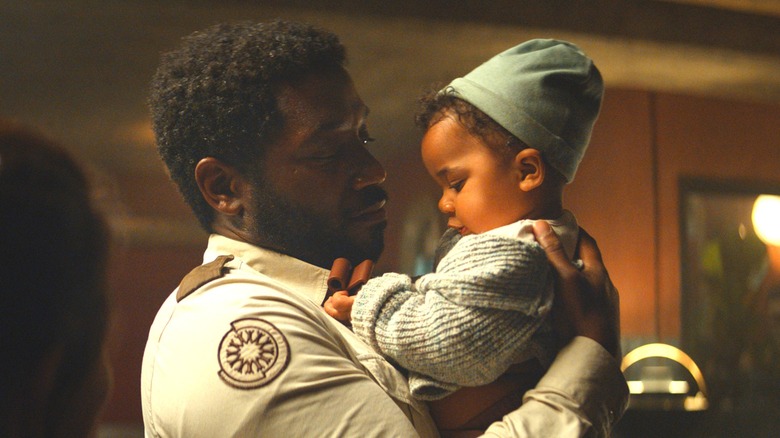 Paul Billings with a baby 