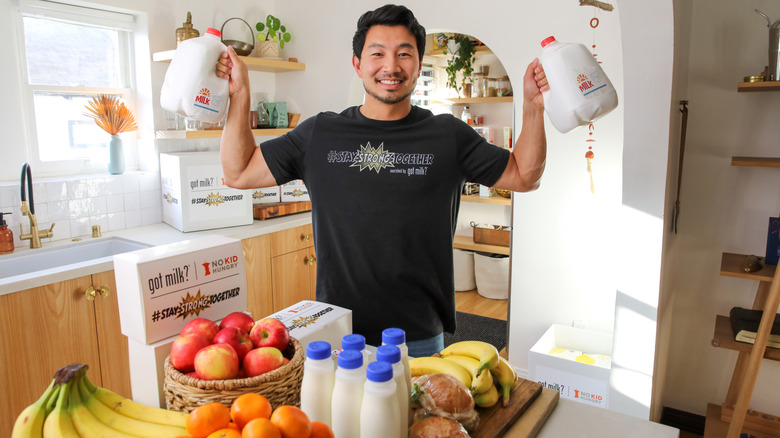 Simu Liu posing for the California Milk Processor Board's "No Kid Hungry" campaign