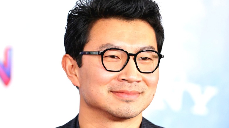 Simu Liu smiles at Spider-Man premiere