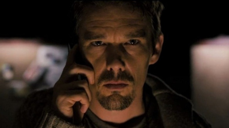 Ellison on the phone in his study