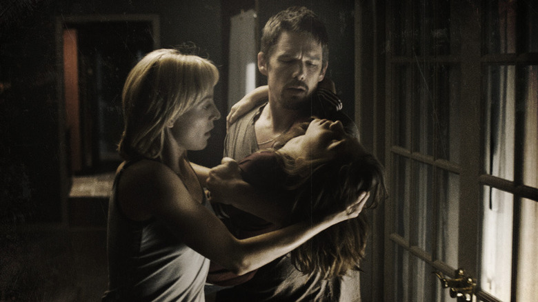 Ellison and Tracy holding a possessed Trevor