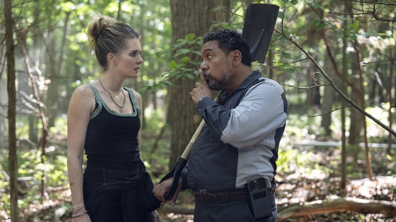 Devon and Jose standing in the woods