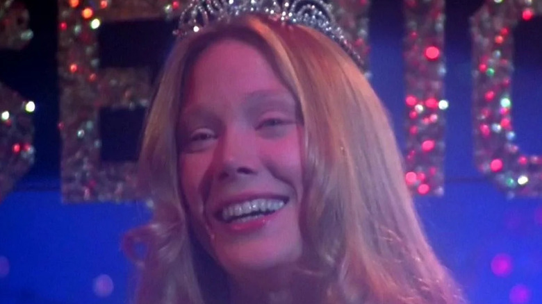 Carrie White smiling and wearing crown