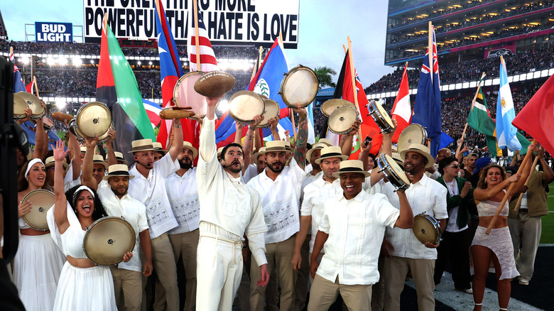 Bad Bunny and a group of musicians exit the stadium during his Super Bowl performance