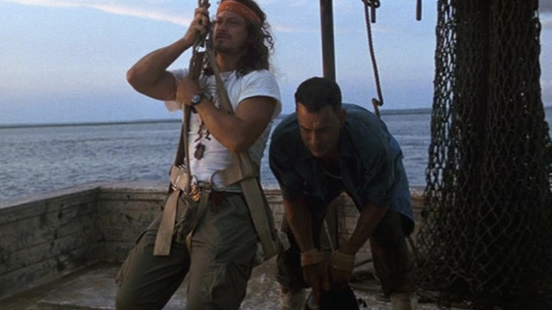 Lt. Dan swings and Forrest crouches