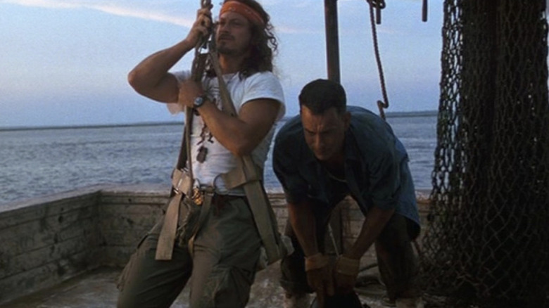 Lt. Dan swings and Forrest crouches