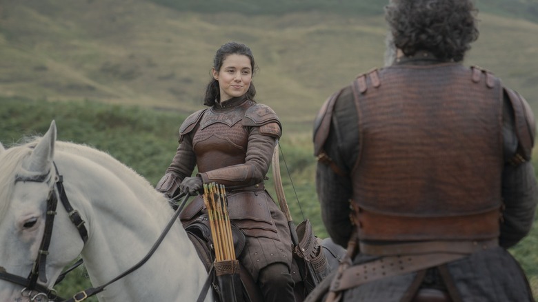 Lady Rhea Royce rides her horse in her armor