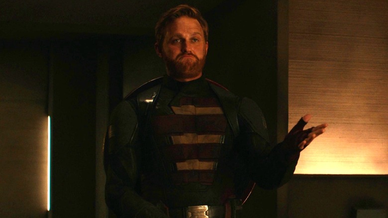 U.S. Agent holding out his left arm