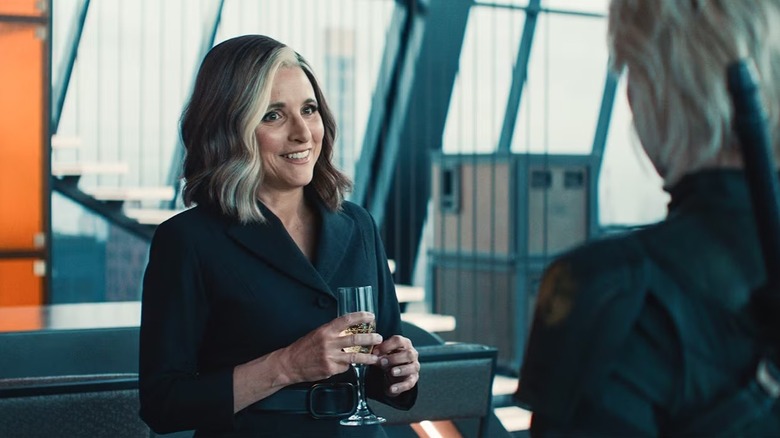 Valentina holding a glass of wine and smiling in Thunderbolts*