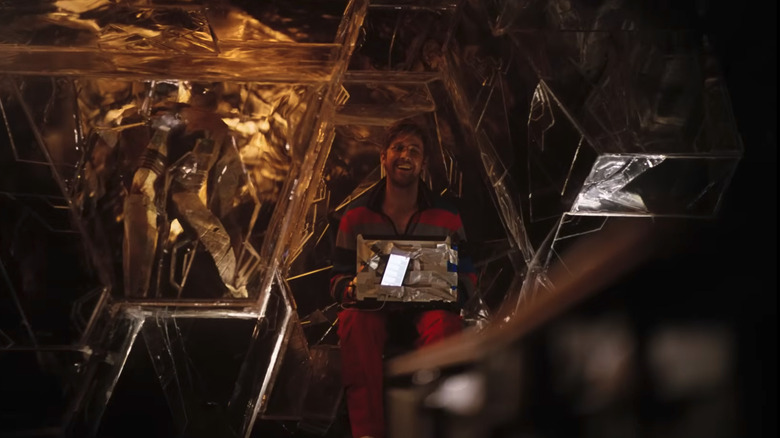 Rocky and Grace on opposite sides of the wall in "Project Hail Mary" (2026)