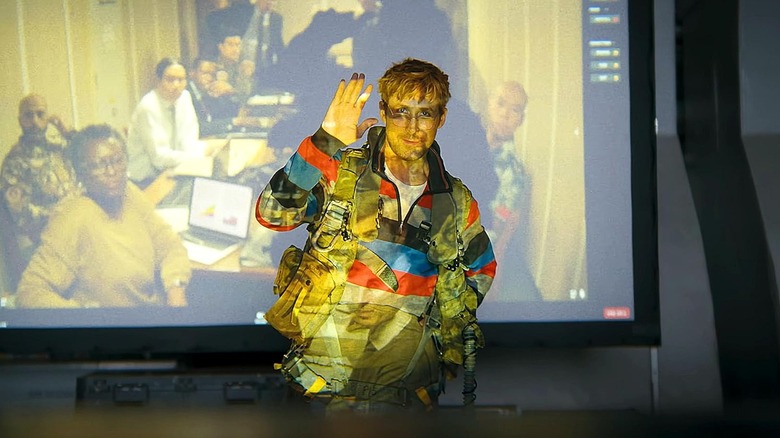 Grace in front of a projector screen in Project Hail Mary
