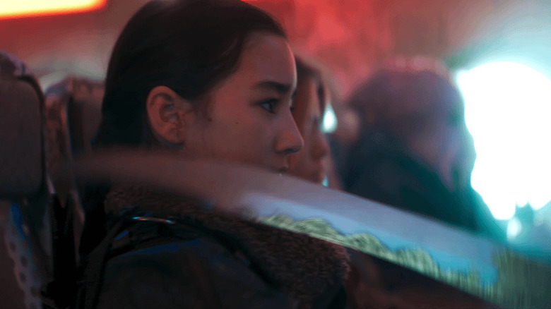 Ruthye with sword on intergalactic bus in Supergirl (2026)