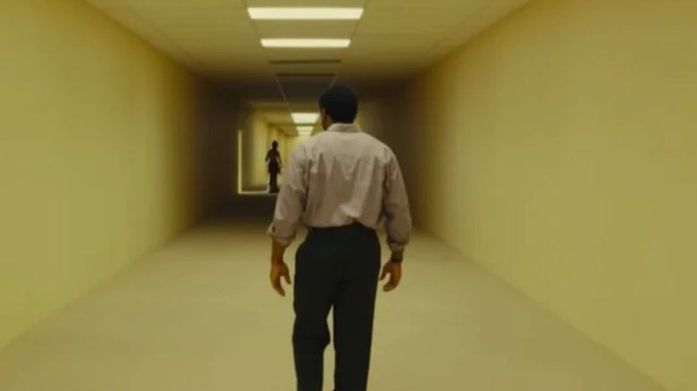 Clark walking towards the caveman cutout in Backrooms (2026)