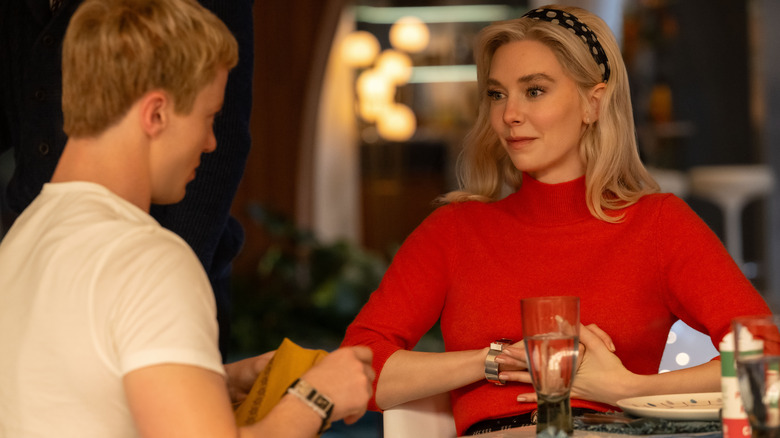 Sue and Johnny Storm sitting at a table in The Fantastic Four: First Steps