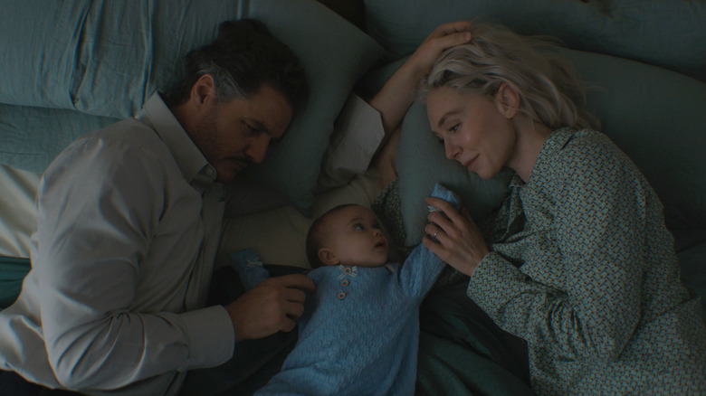 Reed Richards, Sue Storm, and Franklin Richards lying in bed in The Fantastic Four: First Steps