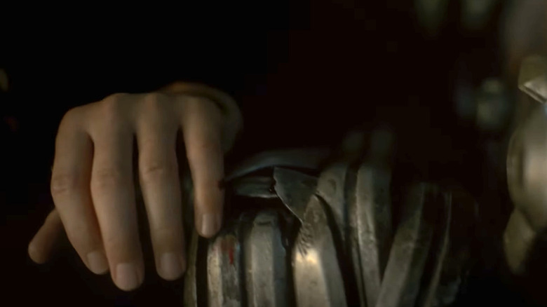 Bloody hand on Iron Throne