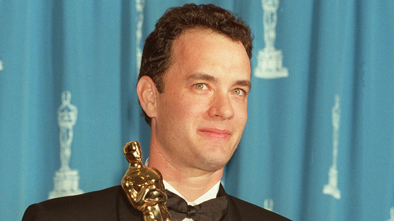 Tom Hanks holding Forrest Gump Oscar