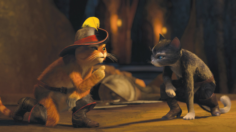 Puss in Boots and Kitty Softpaws discussing evidence in "Puss in Boots"
