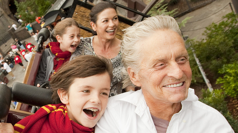 Michael Douglas, Catherine Zeta-Jones, and children on Harry Potter roller coaster