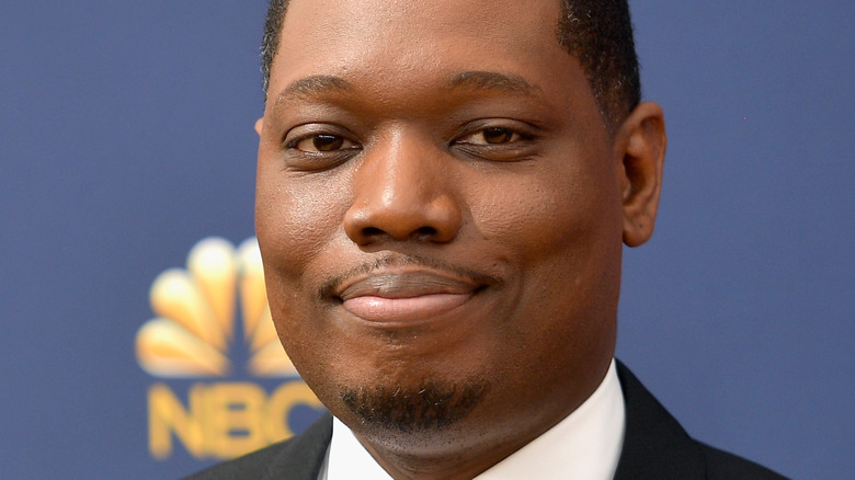 Michael Che on a red carpet