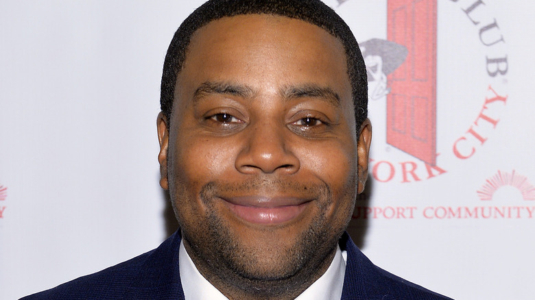 Kenan Thompson smiling at an event