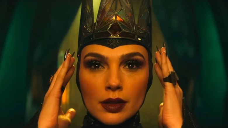 Evil Queen positioning her crown in Snow White