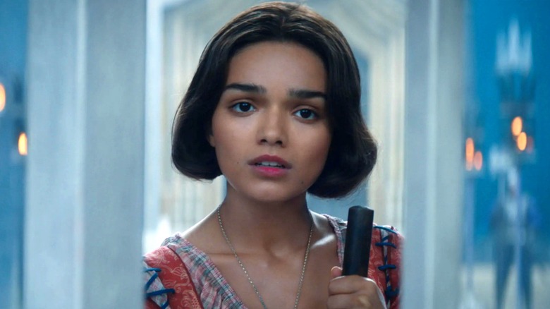 Snow White holding a broom