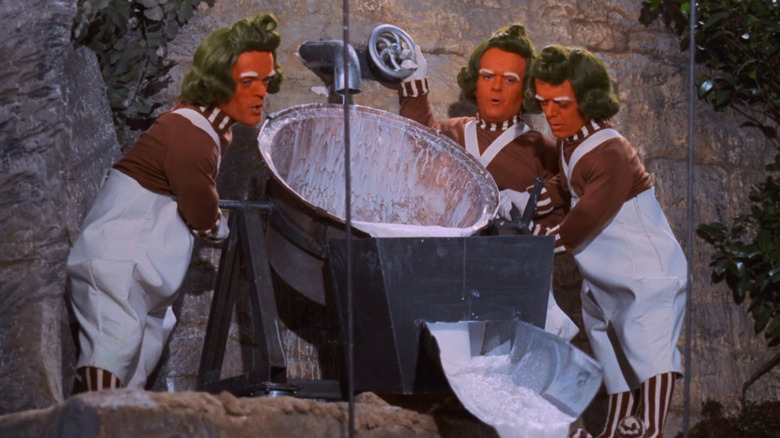 Oompa Loompas pouring liquid and singing