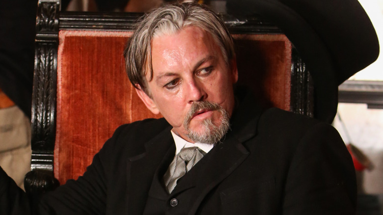 Tommy Flanagan seated in a chair
