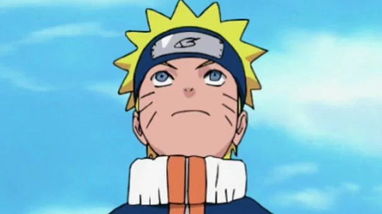 Naruto looking up with the sky behind him