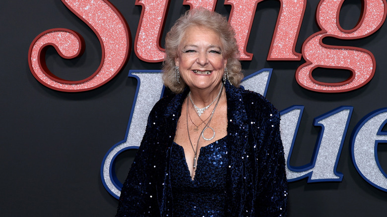 Claire Sardina smiling on the red carpet in 2025