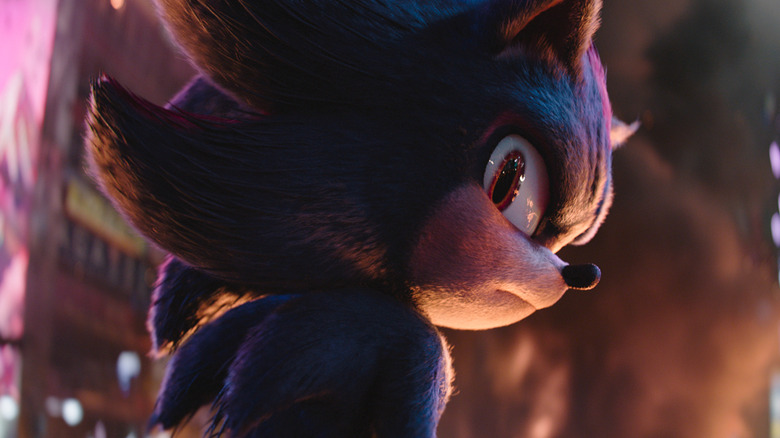 Shadow the Hedgehog looking over his shoulder in the middle of a city in "Sonic the Hedgehog 3"