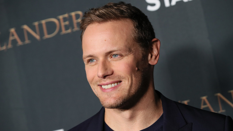Sam Heughan smiles