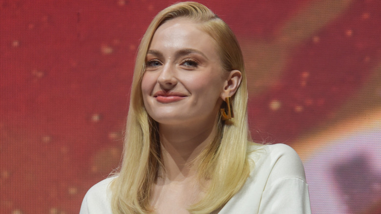 Sophie Turner sitting on a panel at the film X-Men: Black Phoenix Comic Con Experience 2018