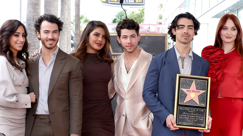 Jonas Brothers and their wives at Walk of Fame ceremony