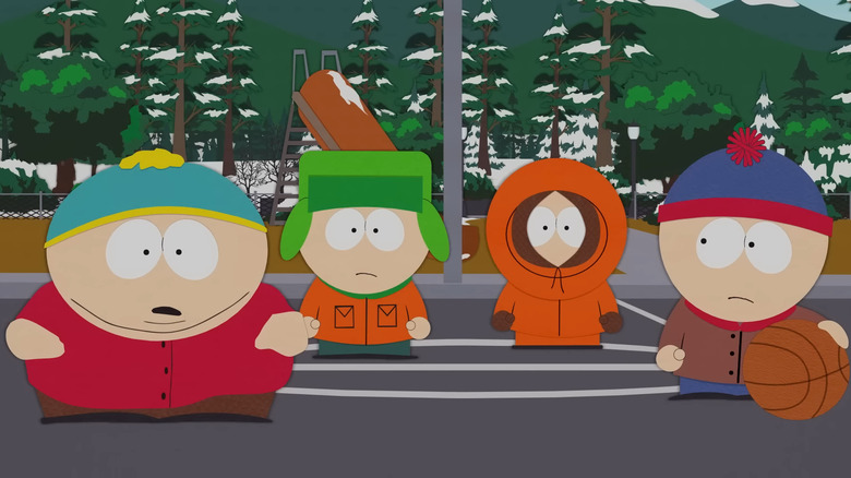 Cartman looking surprised with Kyle, Kenny, and Stan on a basketball court